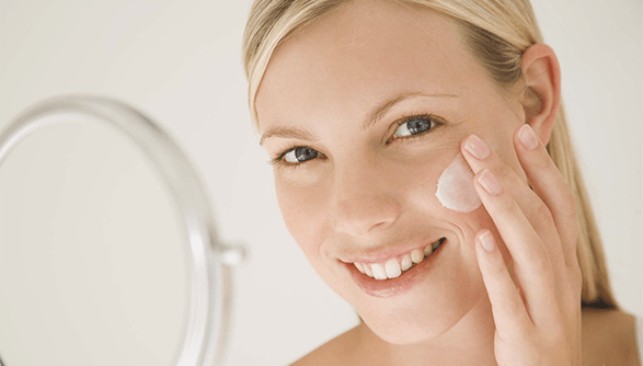 using a cream to rejuvenate the skin of the face